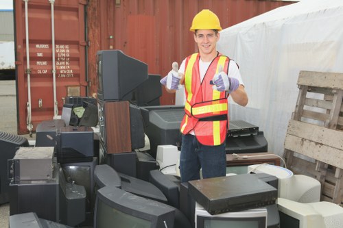 Supervisor examining a skip placement before loading
