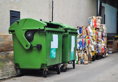 Workers sorting materials at a local transfer station for recycling and reuse